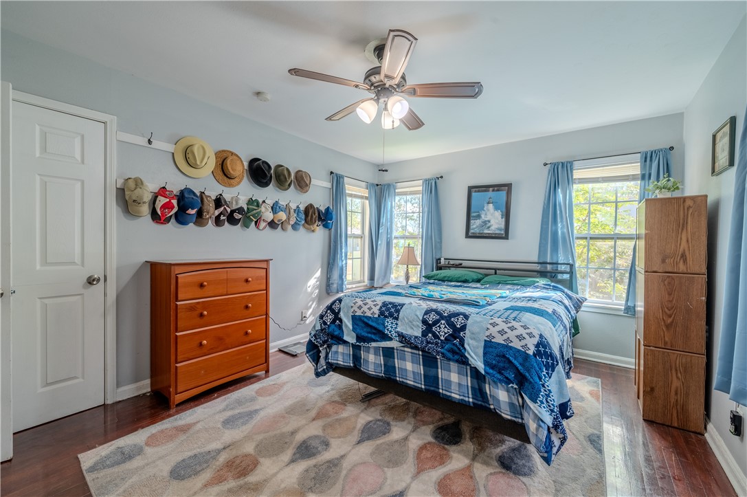 1201 Devon Drive Corpus Christi, TX 78404 - Photo 14 of 23 a bedroom with a bed and a chandelier