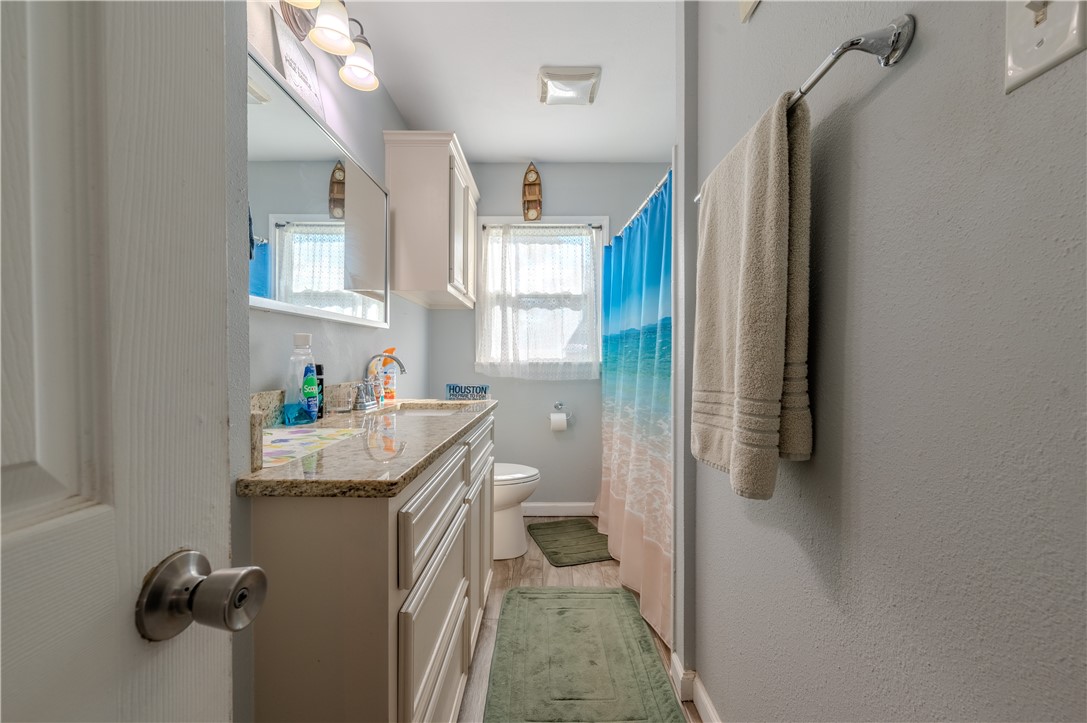1201 Devon Drive Corpus Christi, TX 78404 - Photo 16 of 23 a kitchen with a refrigerator and a sink