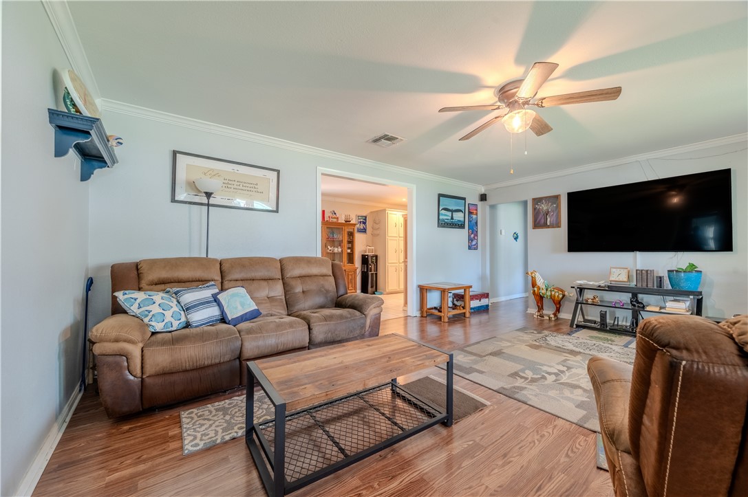 1201 Devon Drive Corpus Christi, TX 78404 - Photo 2 of 23 a living room with furniture and a flat screen tv