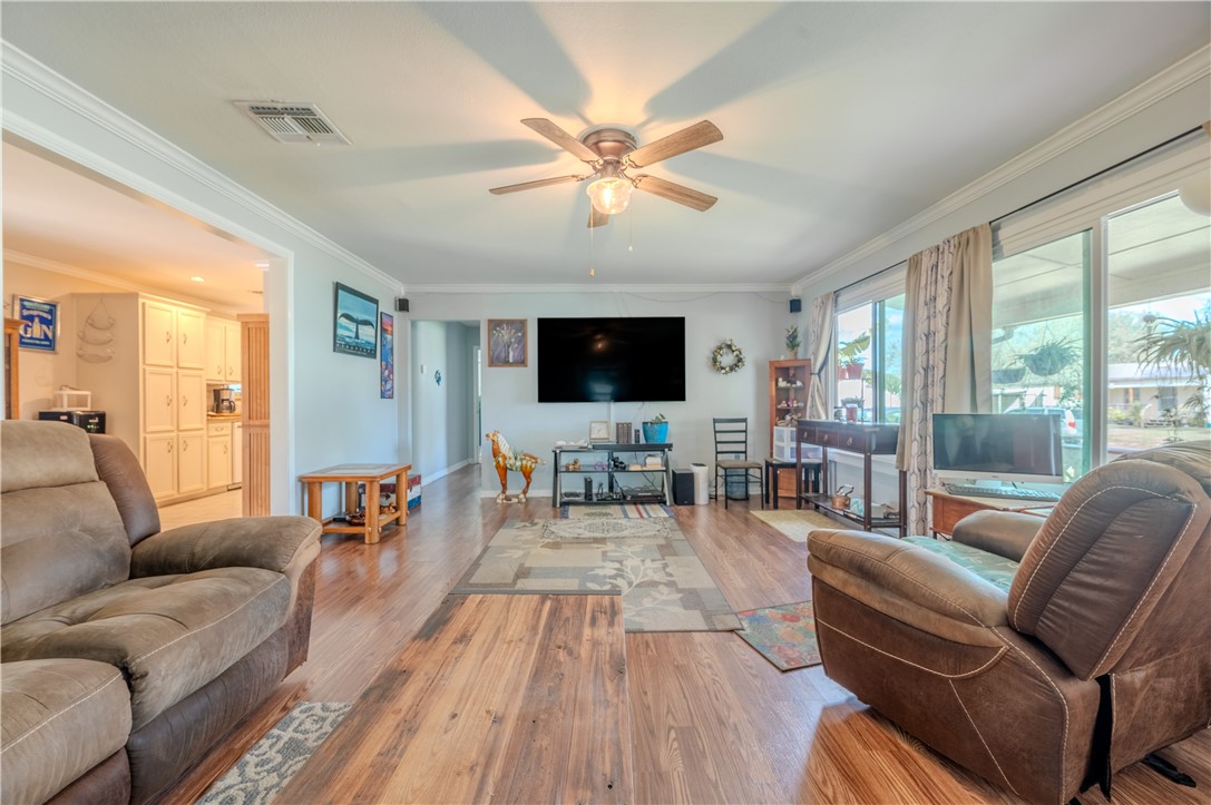 1201 Devon Drive Corpus Christi, TX 78404 - Photo 3 of 23 a living room with furniture and a flat screen tv