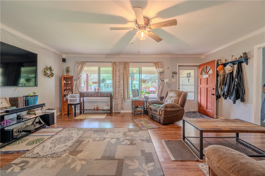 1201 Devon Drive Corpus Christi, TX 78404 - Photo 4 of 23 a living room with furniture and a flat screen tv