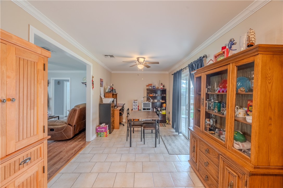 1201 Devon Drive Corpus Christi, TX 78404 - Photo 8 of 23 a living room with furniture and a chandelier