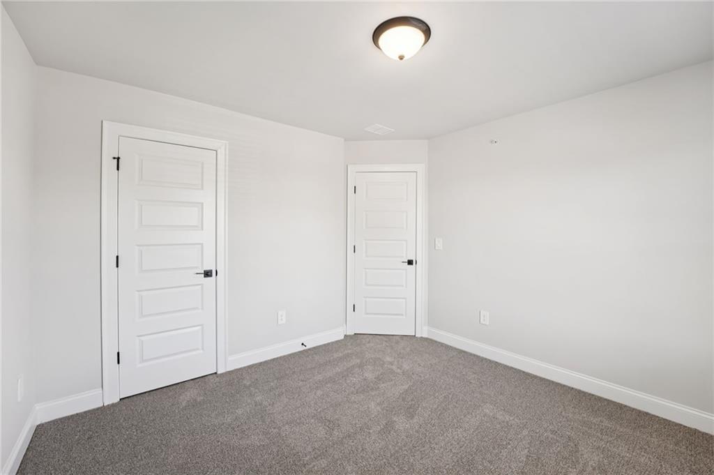 6450 Pinin Place Cumming, GA 30041 - Photo 36 of 53 an empty room with closet area