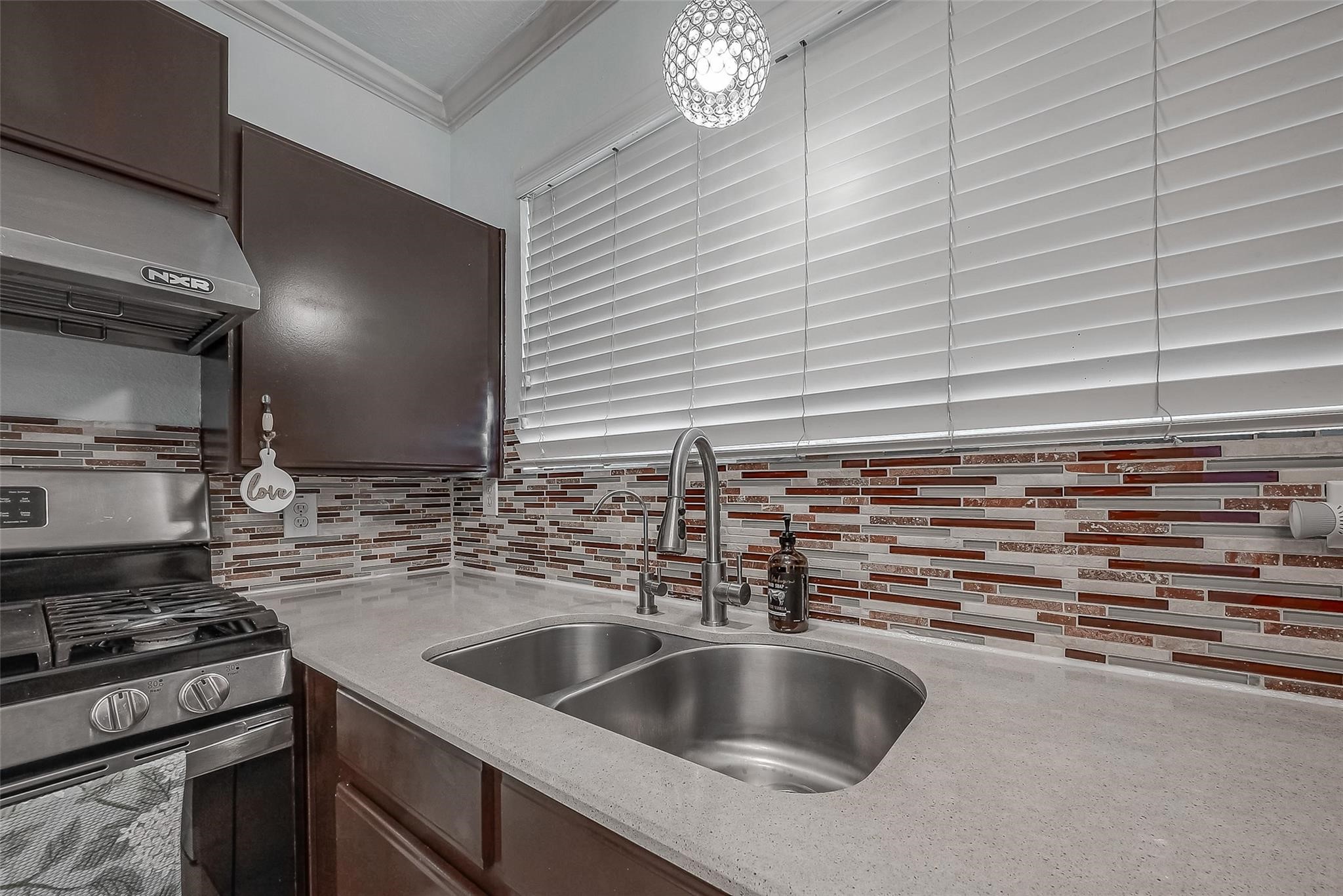 9511 Farrell Drive Houston, TX 77070 - Photo 11 of 28 a kitchen with a sink and a stove