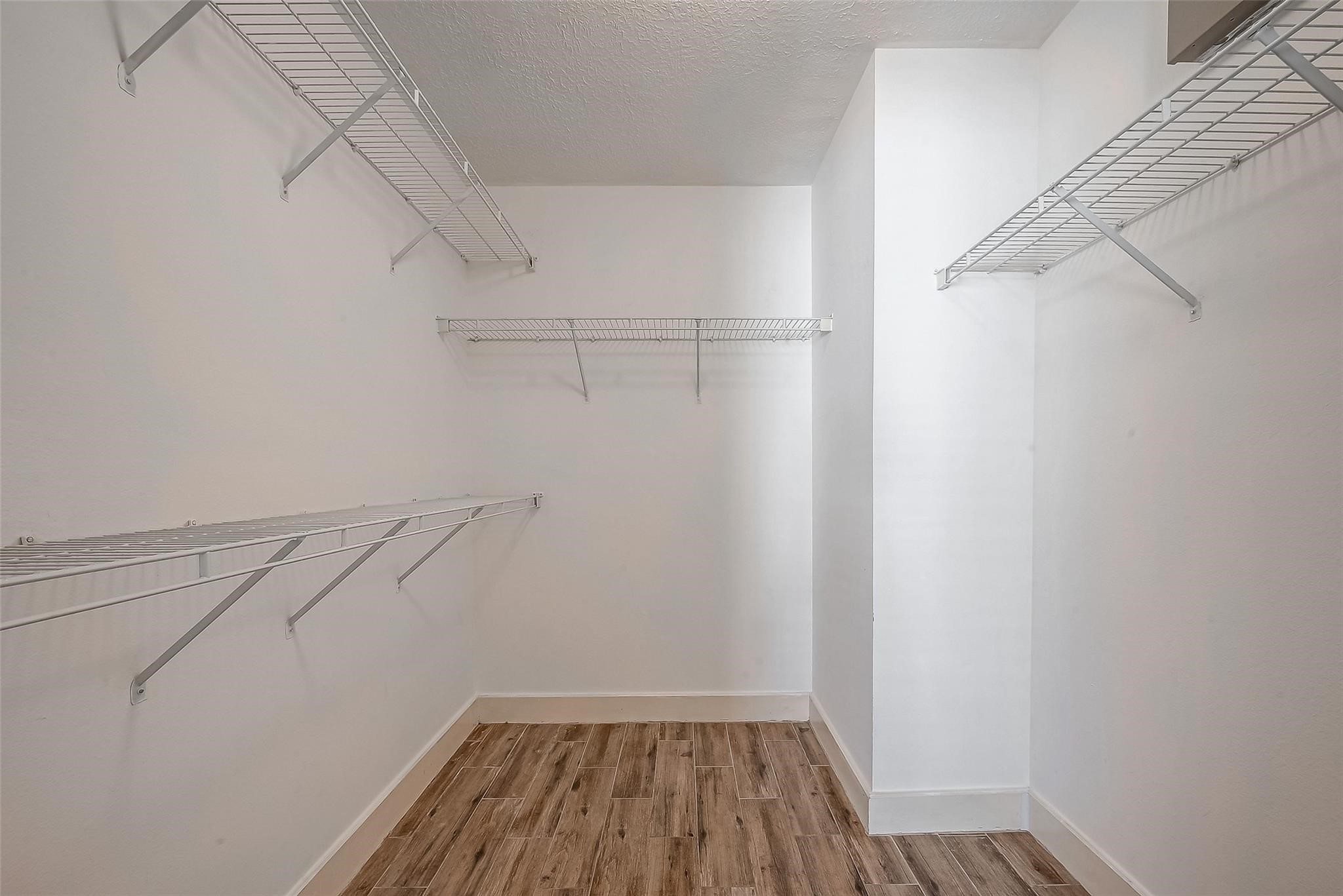 9511 Farrell Drive Houston, TX 77070 - Photo 16 of 28 a view of a room with racks on the wall