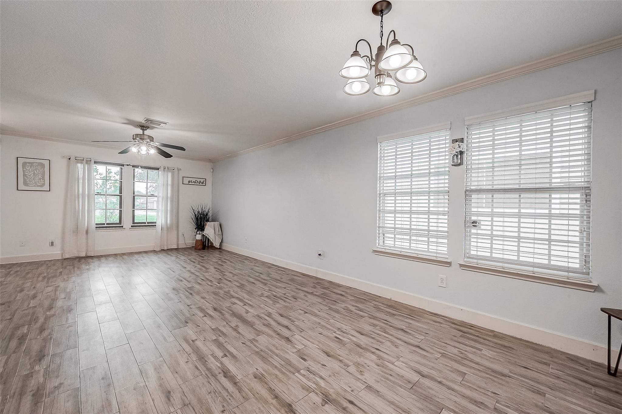 9511 Farrell Drive Houston, TX 77070 - Photo 4 of 28 a view of an empty room with wooden floor and a window