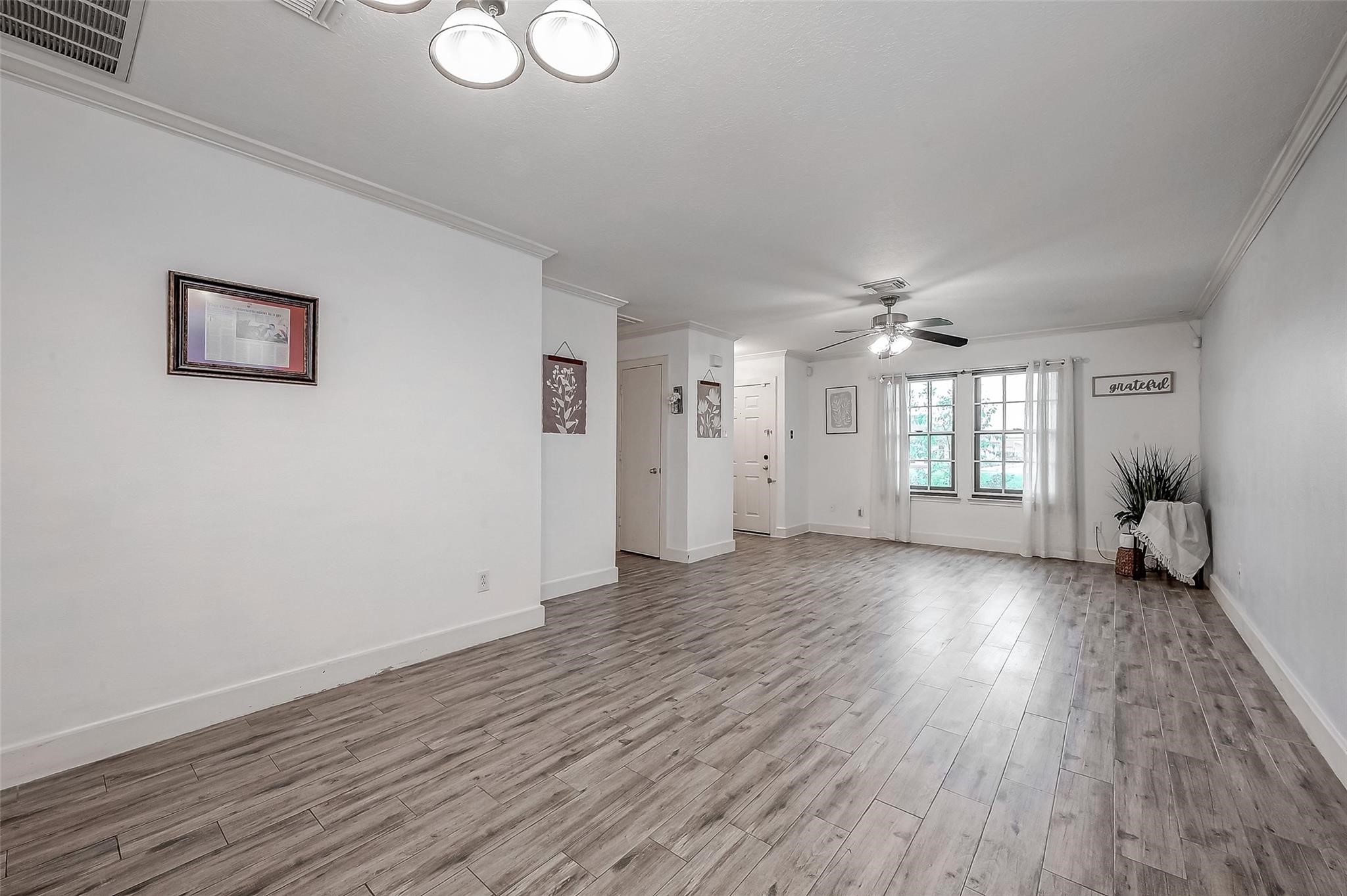 9511 Farrell Drive Houston, TX 77070 - Photo 6 of 28 a view of livingroom with hardwood floor and window
