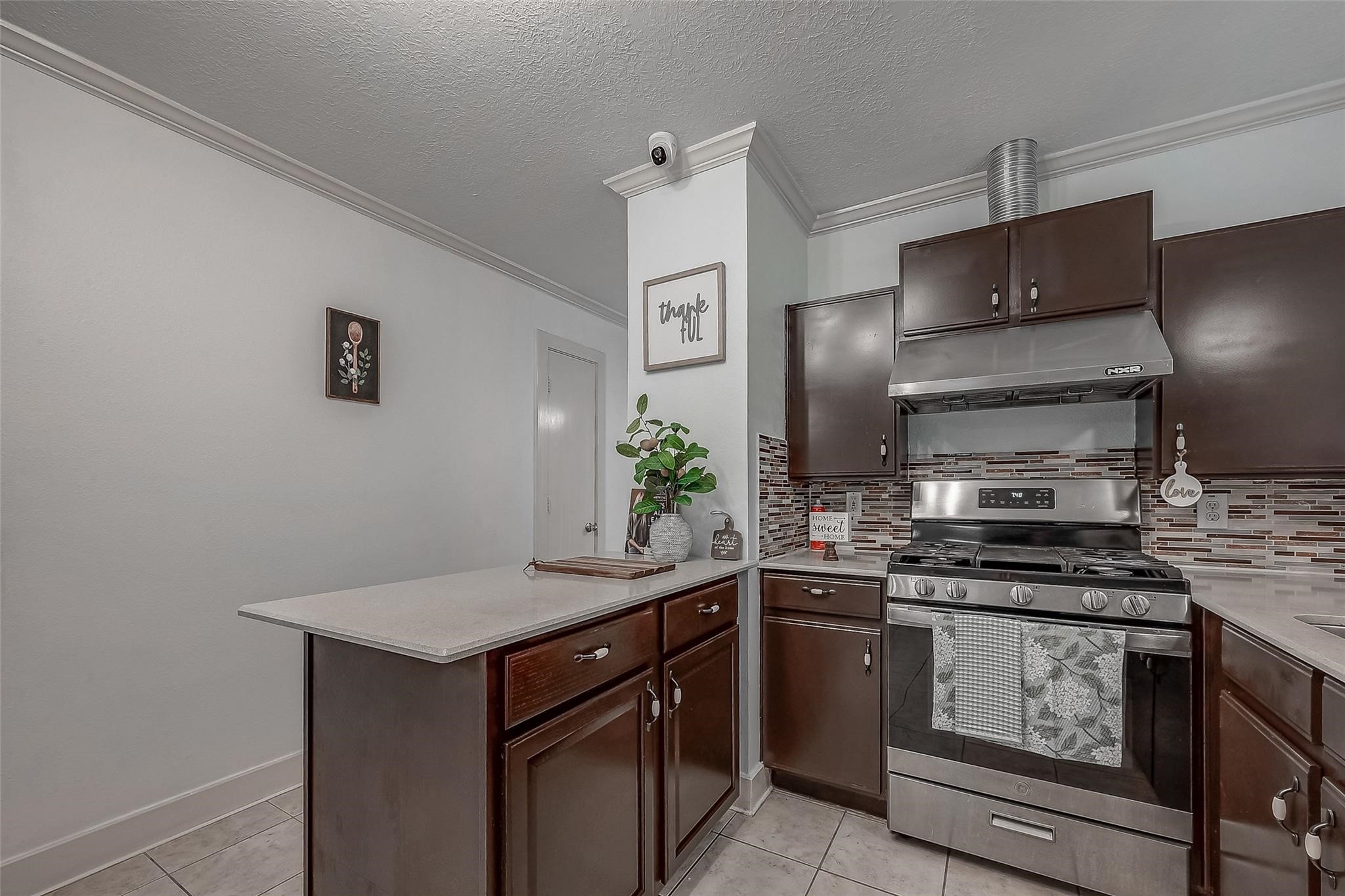 9511 Farrell Drive Houston, TX 77070 - Photo 9 of 28 a kitchen with stainless steel appliances granite countertop a stove and a sink