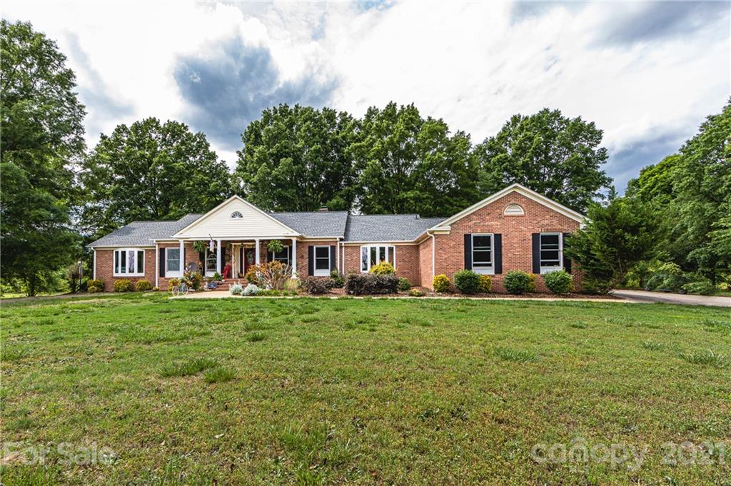 515 Windy Hill Road York, SC 29745 - Photo 2 of 45 a front of a house with yard and green space