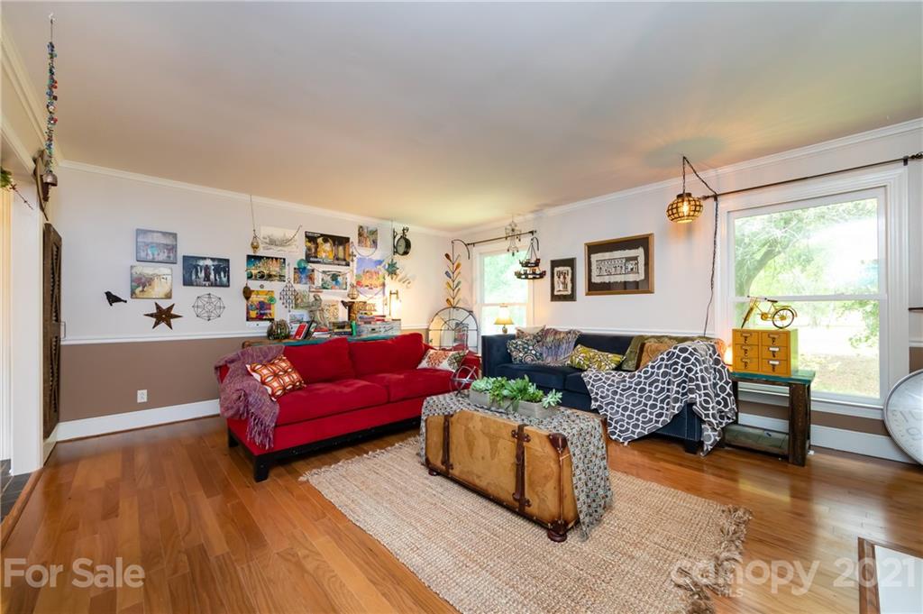 515 Windy Hill Road York, SC 29745 - Photo 11 of 45 a living room with furniture and a wooden floor