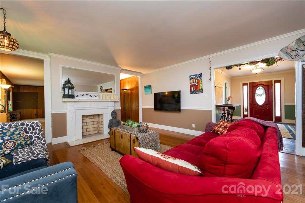 515 Windy Hill Road York, SC 29745 - Photo 13 of 45 a living room with furniture a flat screen tv and a fireplace