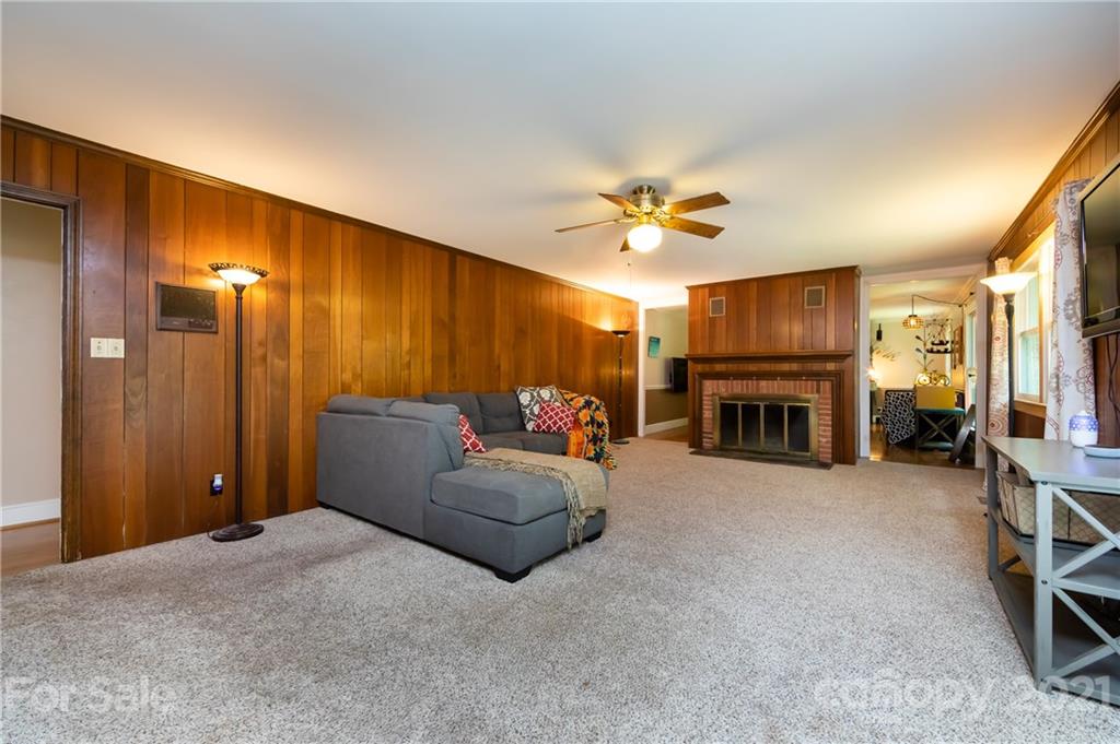 515 Windy Hill Road York, SC 29745 - Photo 14 of 45 a living room with furniture a fireplace and a ceiling fan