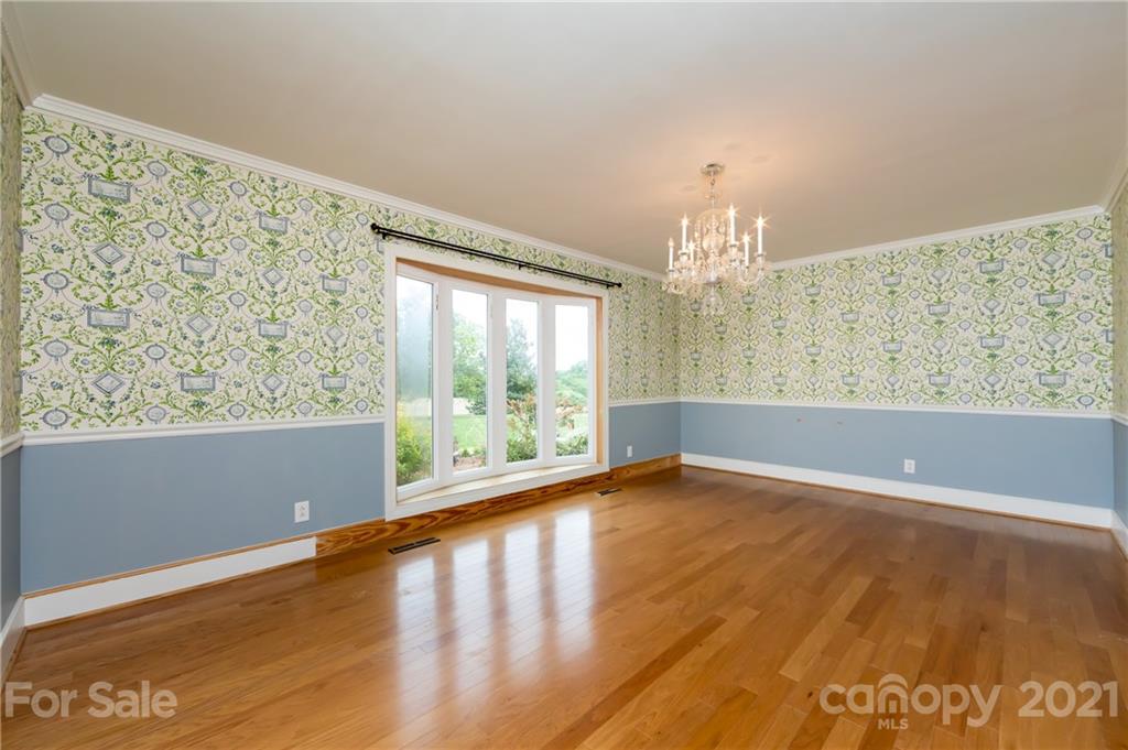 515 Windy Hill Road York, SC 29745 - Photo 16 of 45 a view of an empty room with wooden floor and a window