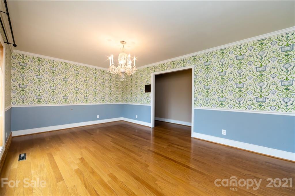 515 Windy Hill Road York, SC 29745 - Photo 17 of 45 a view of a room with wooden floor and chandelier