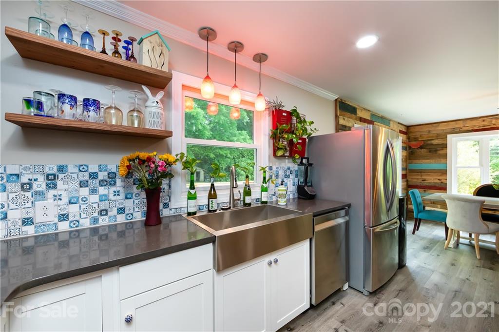 515 Windy Hill Road York, SC 29745 - Photo 20 of 45 a kitchen with stainless steel appliances granite countertop a refrigerator and a dining table