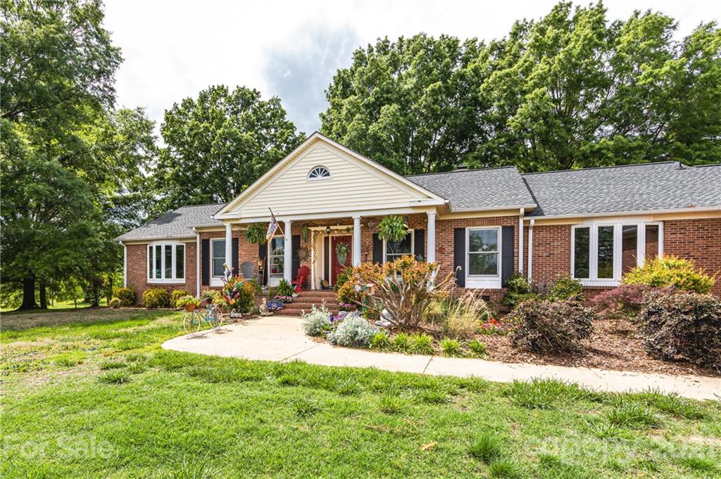 515 Windy Hill Road York, SC 29745 - Photo 3 of 45 a front view of house with yard and green space
