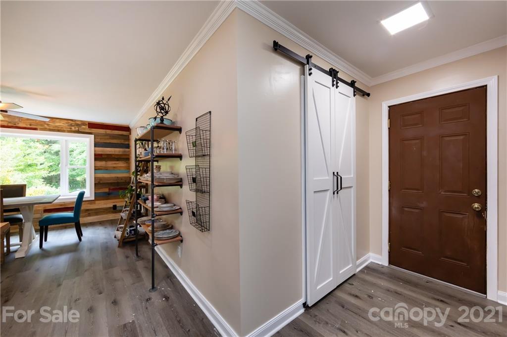 515 Windy Hill Road York, SC 29745 - Photo 26 of 45 a view of a hallway with wooden floor and windows