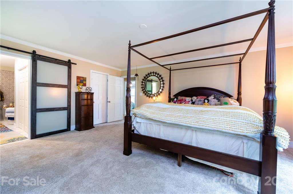 515 Windy Hill Road York, SC 29745 - Photo 29 of 45 a bedroom with a bed next to a window with outer view