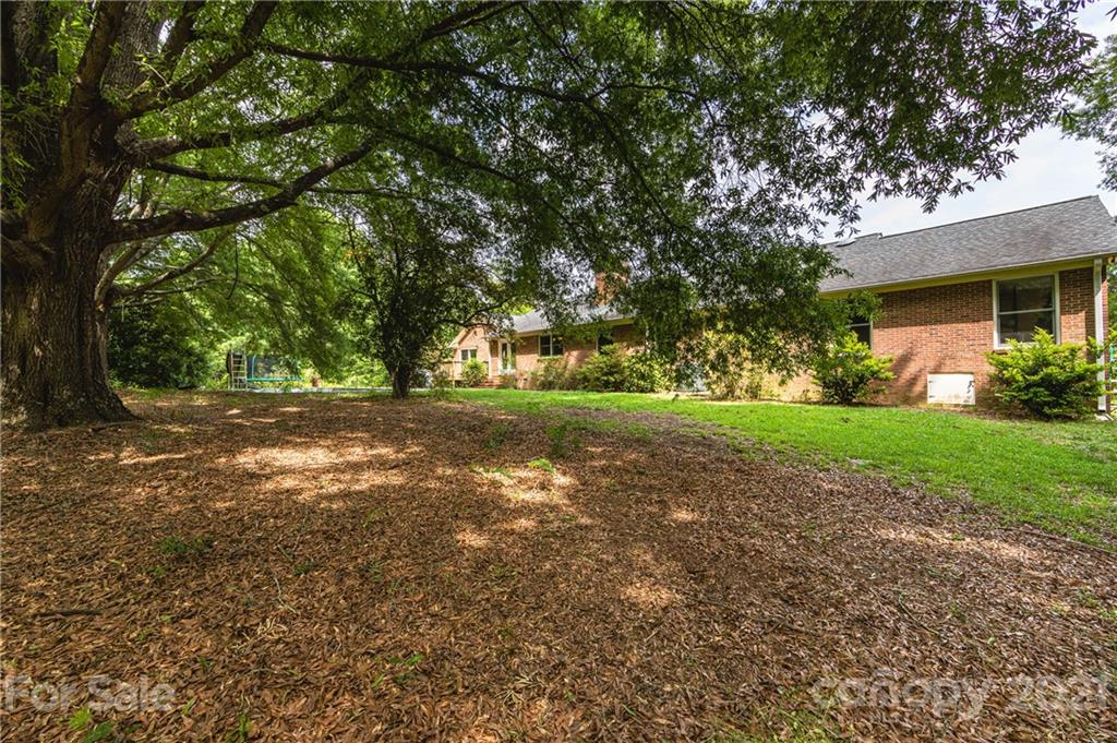515 Windy Hill Road York, SC 29745 - Photo 42 of 45 a view of outdoor space with deck and tree