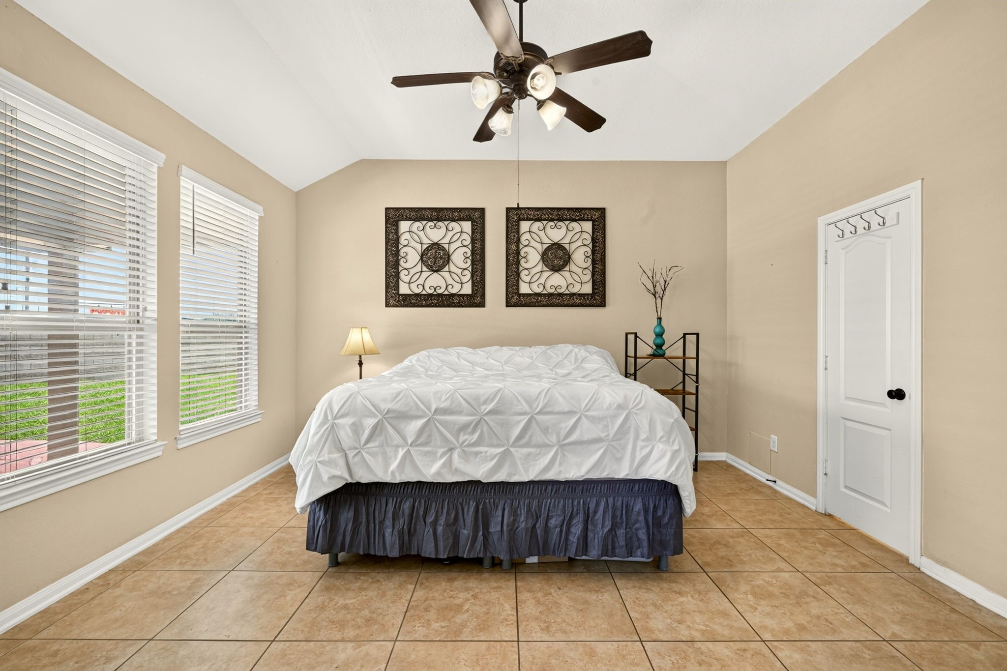 6446 Tea Tree Drive Katy, TX 77494 - Photo 20 of 39 14x14 Primary Bedroom -
A spa-like peaceful environment on the first floor overlooking the backyard pool.