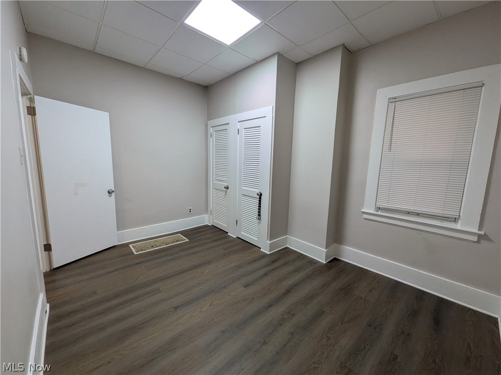 1881 Manchester Road, Unit 1 Akron, OH 44314 - Photo 12 of 44 1881 Manchester Rd, Akron, OH 44314 Unit #1 ground floor access and living. Welcome to this spacious 2-bedroom, 1-bathroom first-floor generous and remodeled apartment in the Kenmore neighborhood of Akron, offering a great amount of comfortable living space. This move-in ready apartment features LVP flooring throughout, a spacious living room, room for dining, separate kitchen with a gas range and stainless steel refrigerator, two bedrooms, and a full private bathroom which has a convenient step-in shower. Large windows provide natural light, while ample closets offer plenty of storage. Enjoy off-street parking and a backyard with a picnic table and small firepit, providing a pleasant outdoor space to relax and enjoy for the buildings tenants.