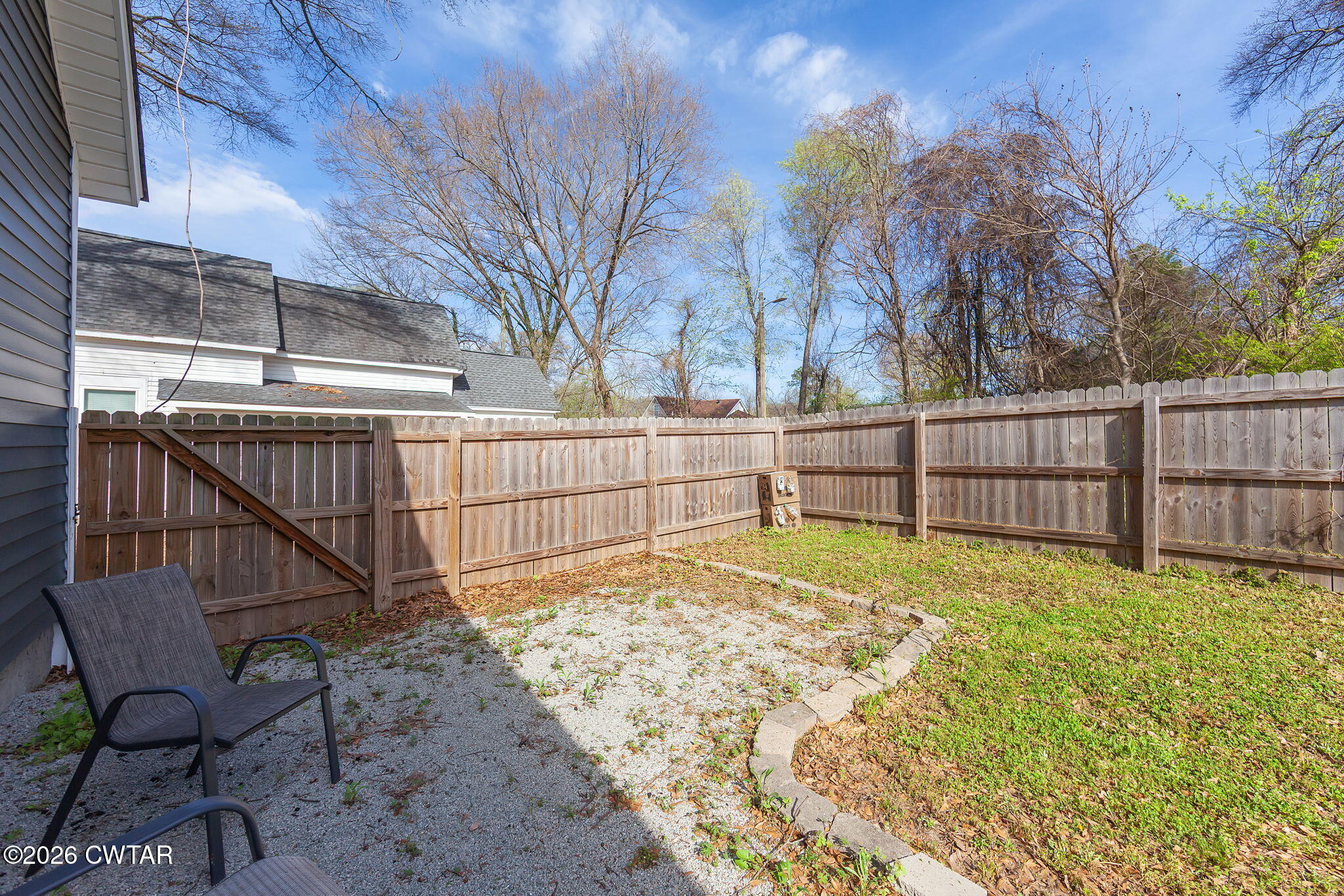 209 Hatton Street Jackson, TN 38301 - Photo 18 of 20 a view of backyard with trees