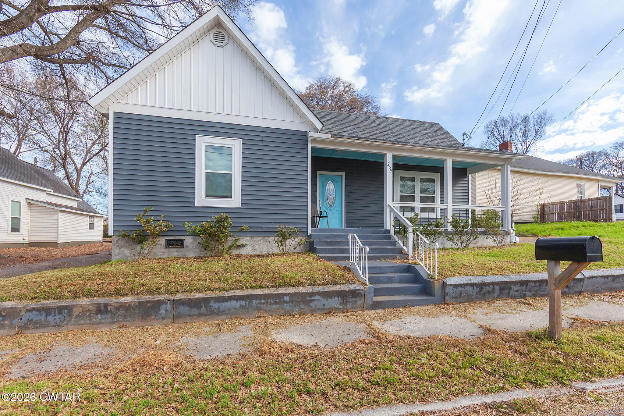 209 Hatton Street Jackson, TN 38301 - Photo 2 of 20 a front view of a house with swimming pool