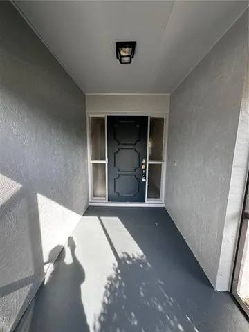 a front view of a house with a empty space