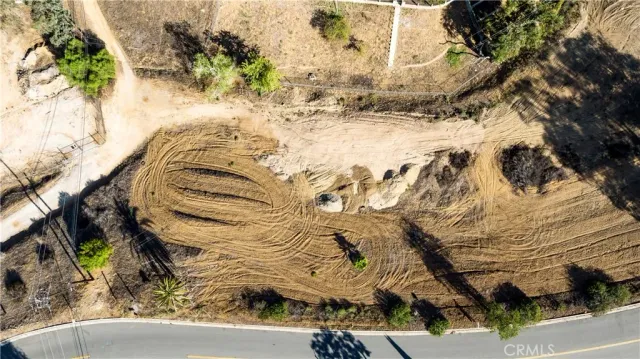 an aerial view of a residential houses and city street