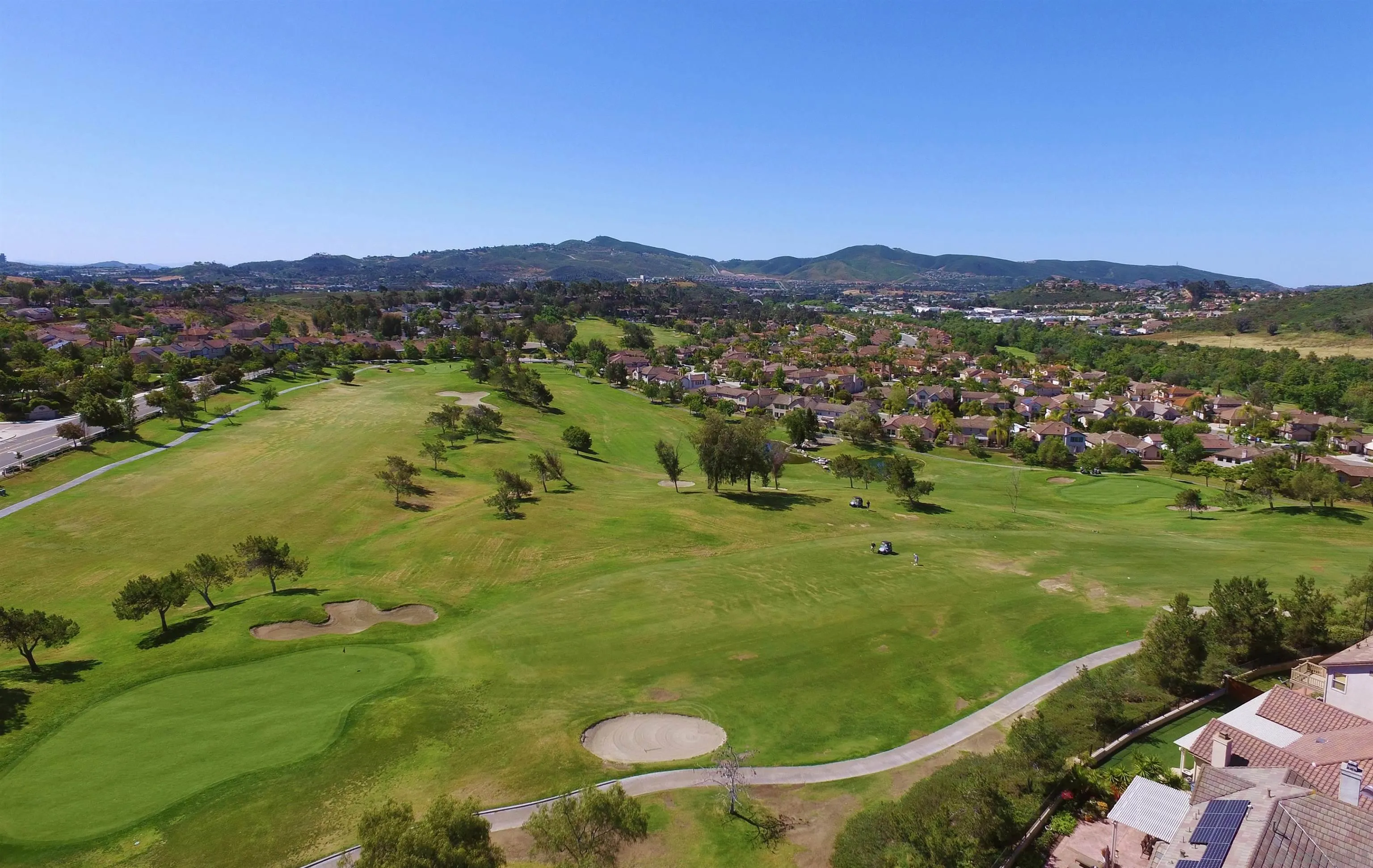 1783 Medinah Road San Marcos, CA 92069 - Photo 38 of 39 a view of a city with mountains in the background
