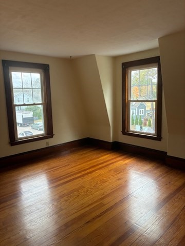 54 High Street South, Unit 54 Barre, MA 01074 - Photo 6 of 10 an empty room with wooden floor and windows