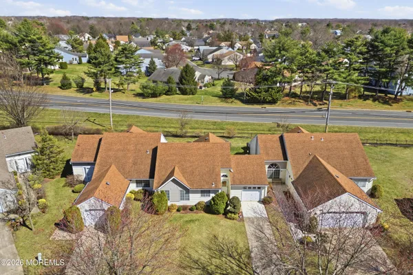 an aerial view of a house with a lake view