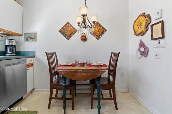 a view of a dining room and a table