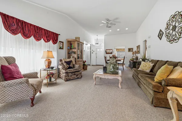 a bedroom with furniture and a chandelier