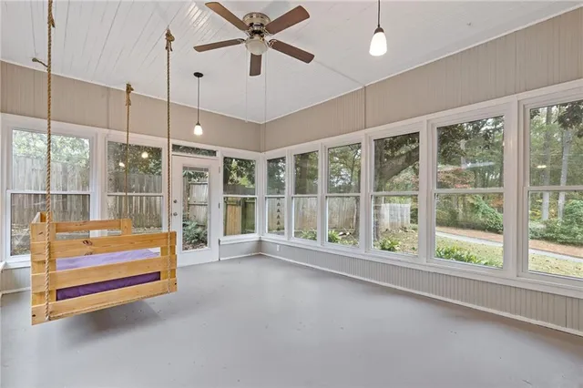 a view of room with air conditioner and windows