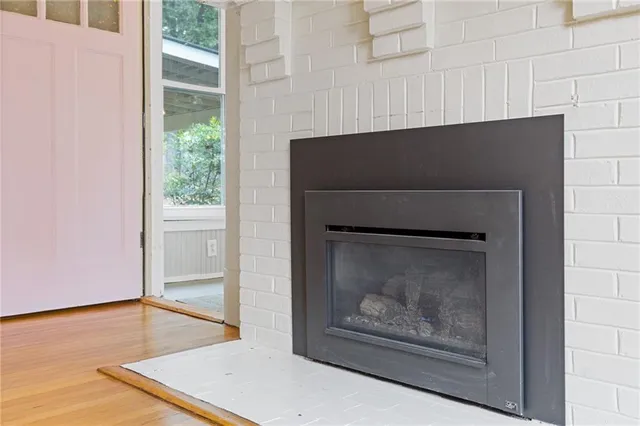 a closeup of a fireplace with a wooden floor