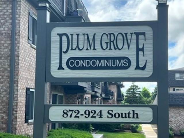920 South Plum Grove Road, Unit 225 Palatine, IL 60067 - Photo 1 of 15 a street sign on a brick wall