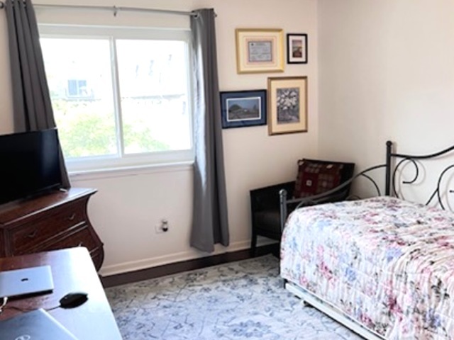 920 South Plum Grove Road, Unit 225 Palatine, IL 60067 - Photo 11 of 15 a bedroom with a bed and a window