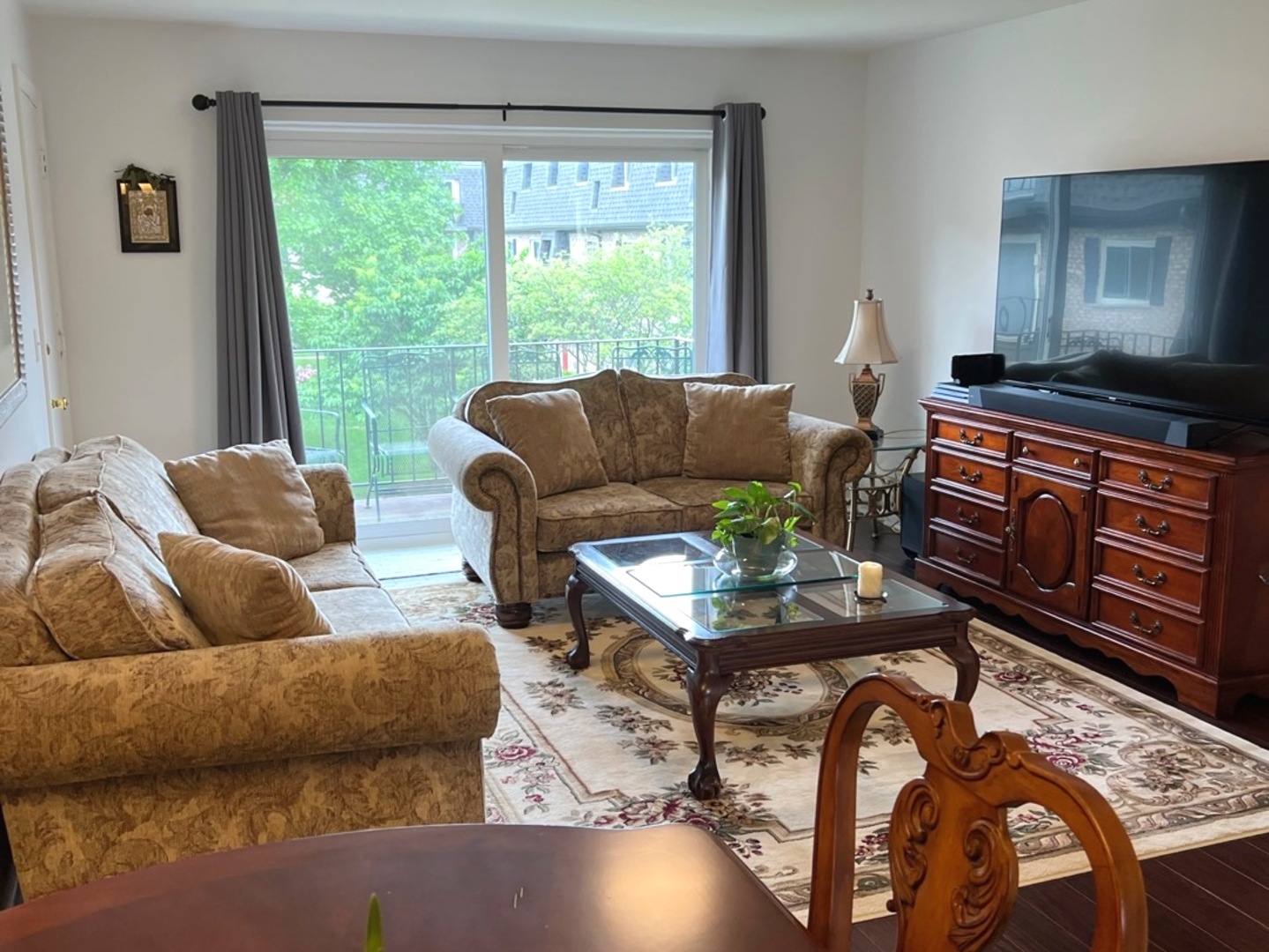 920 South Plum Grove Road, Unit 225 Palatine, IL 60067 - Photo 8 of 15 a living room with furniture and a large window