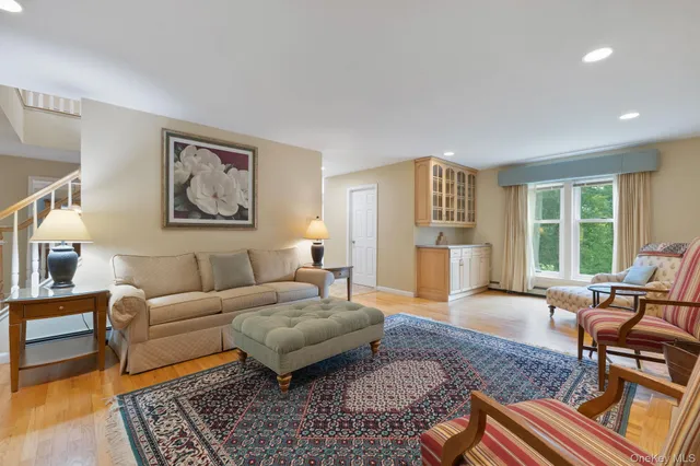 a living room with furniture and a rug