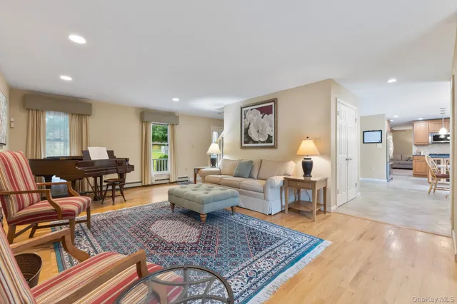 a living room with furniture and a rug