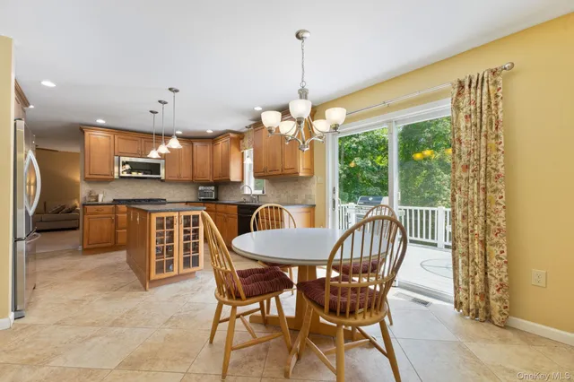 a view of a dining room with furniture window and outside view