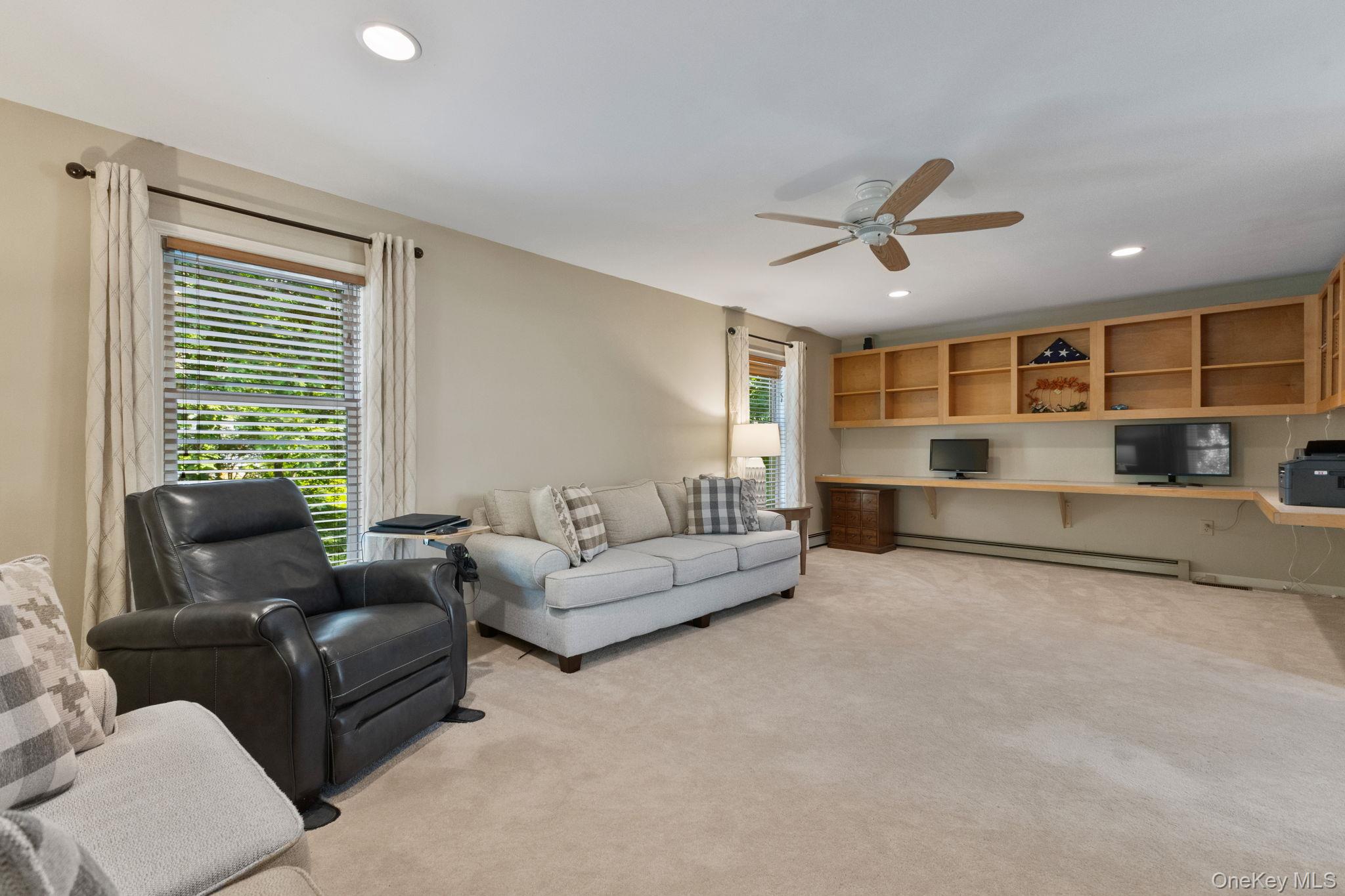 9 Windswept Circle Brewster, NY 10509 - Photo 20 of 43 a living room with furniture and windows