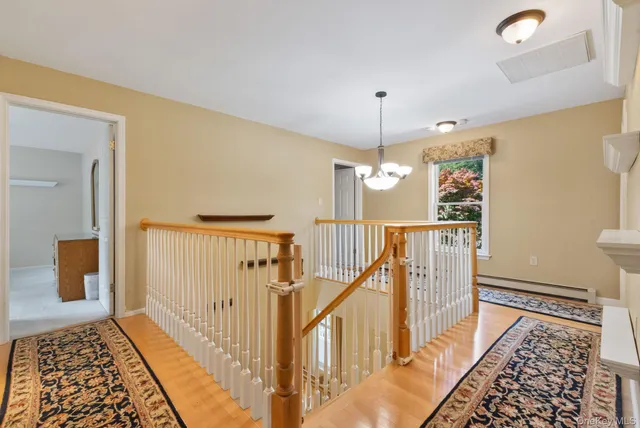 a view of a hallway with a furniture