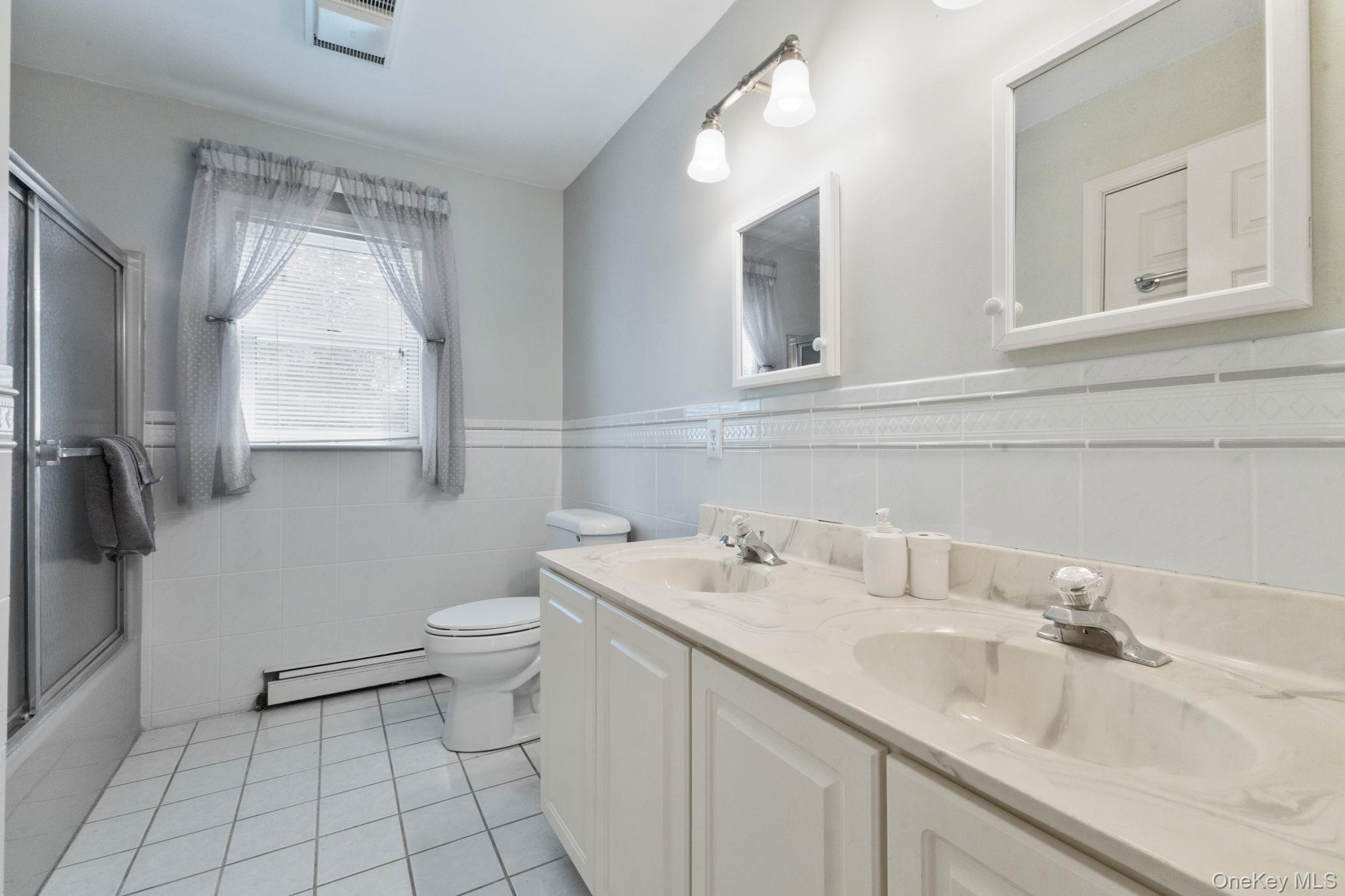 9 Windswept Circle Brewster, NY 10509 - Photo 27 of 43 a bathroom with a sink toilet and mirror