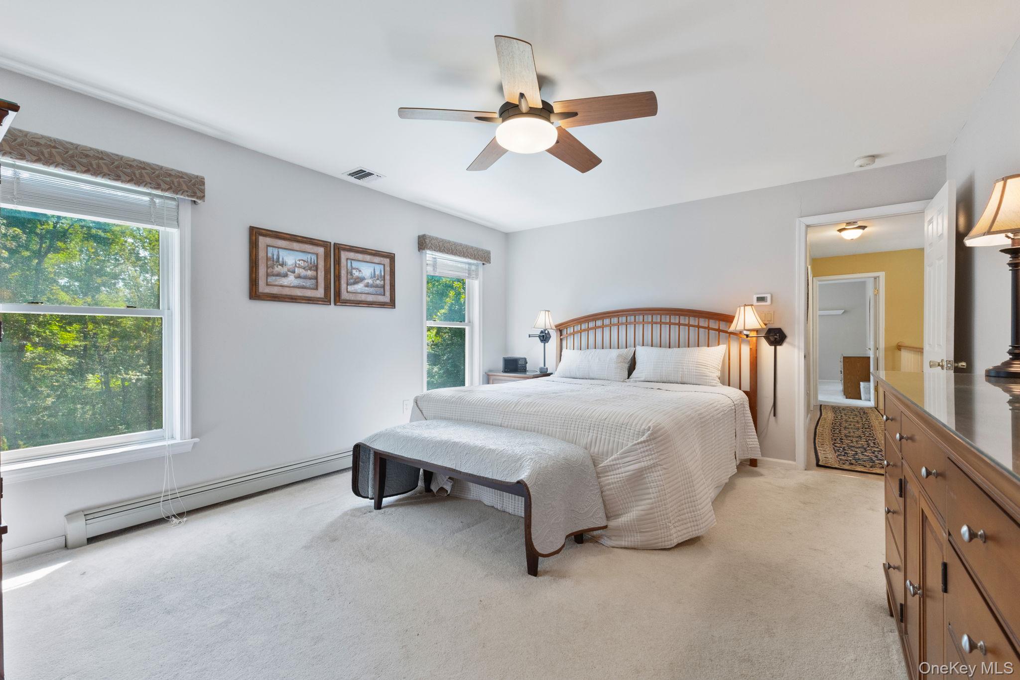 9 Windswept Circle Brewster, NY 10509 - Photo 32 of 43 a bedroom with a large bed and a window