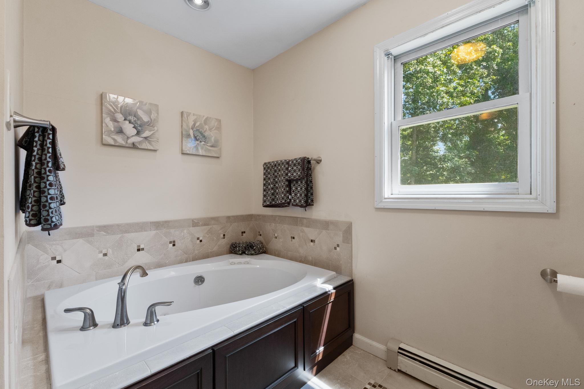 9 Windswept Circle Brewster, NY 10509 - Photo 35 of 43 a bathroom with a bathtub and a window