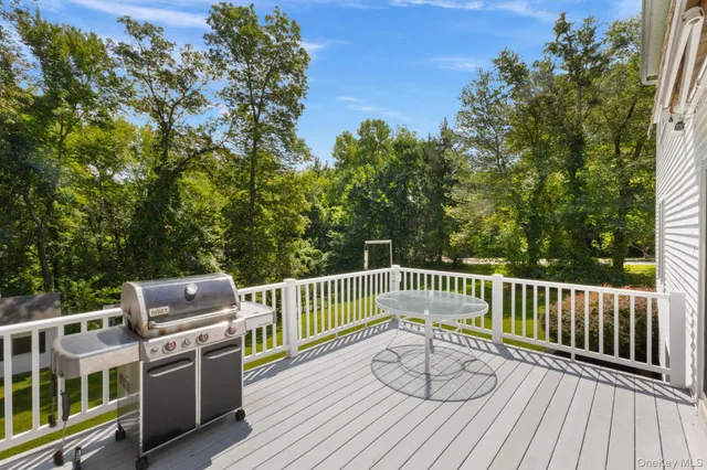 a view of a deck with furniture and wooden floor