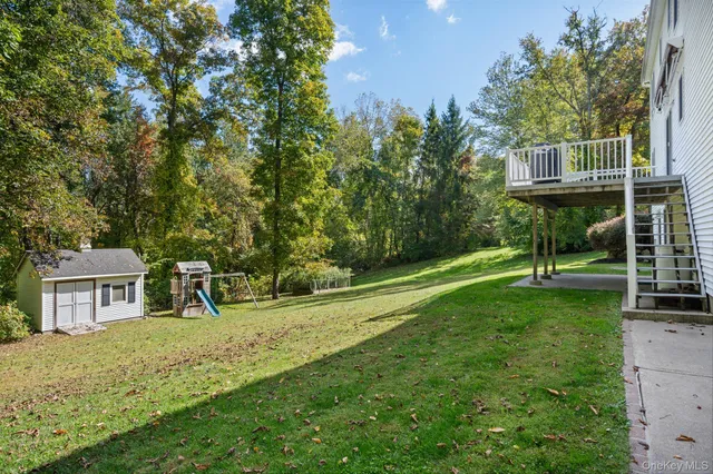 a house view with a sitting space and garden