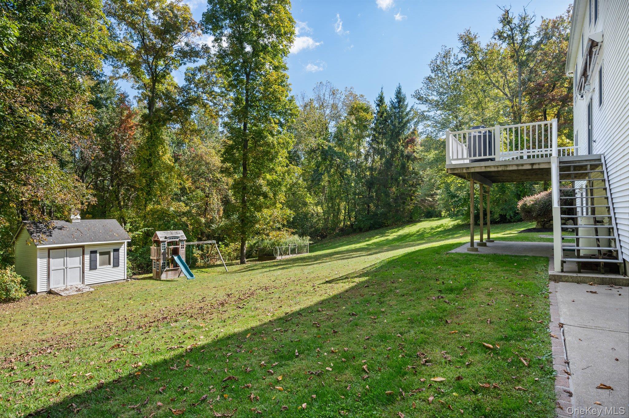 9 Windswept Circle Brewster, NY 10509 - Photo 4 of 43 a house view with a sitting space and garden